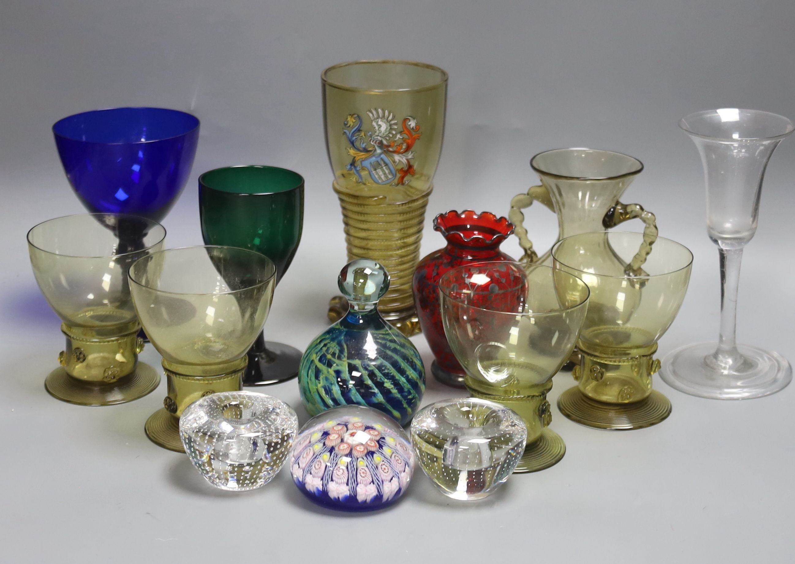 A German glass beaker with enamelled crest, 17.5cm, four Roemers, a millefiori paperweight and coloured glassware